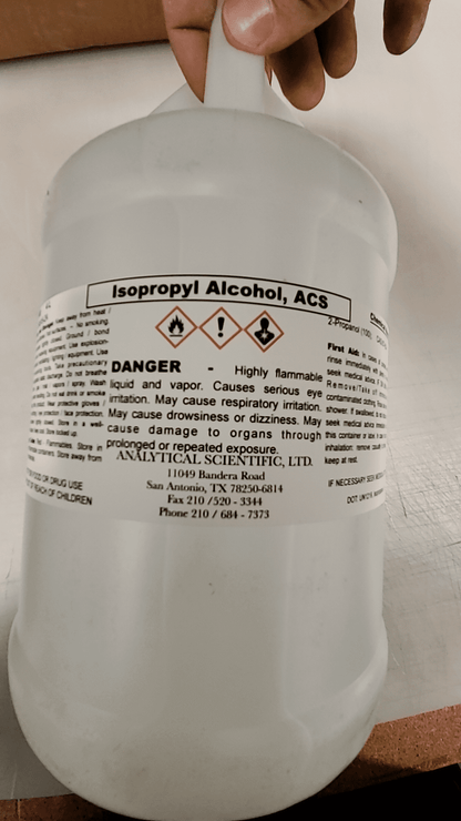White 4L bottle of Isopropyl Alcohol ACS grade with warning labels and usage information.