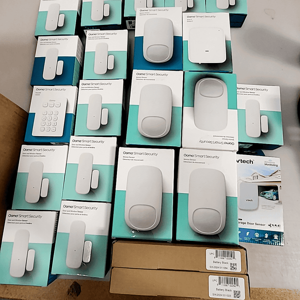 Complete Ooma Smart Home Security System kit featuring door, window, and motion sensors in mint condition.