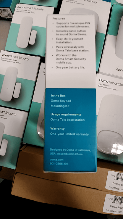 Ooma Smart Security features and tablet display with keypad and mounting kit details.
