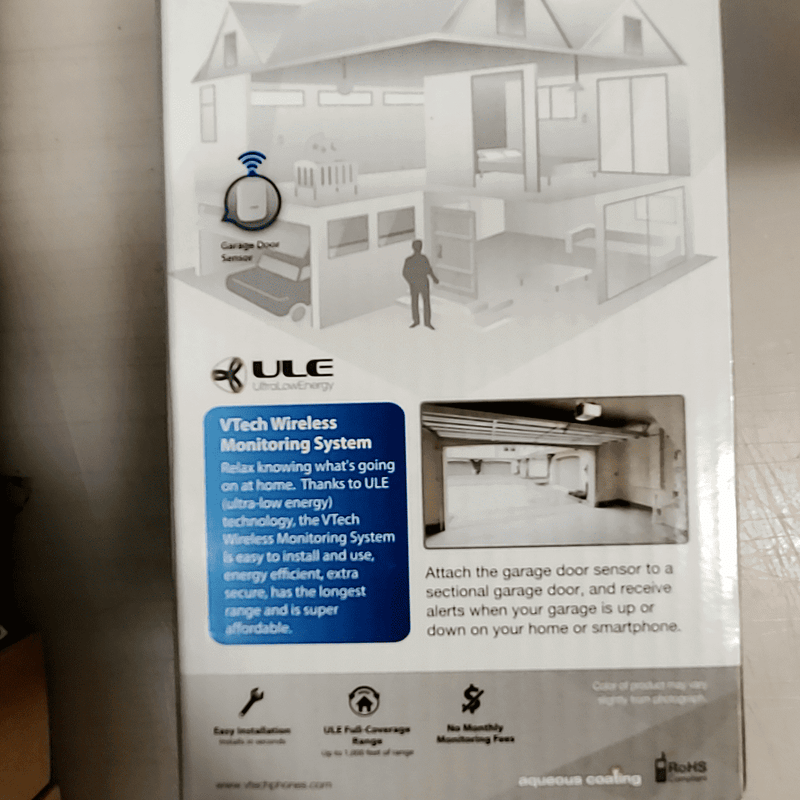 VTech Wireless Monitoring System packaging showing features for garage door security.